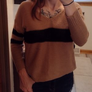 Cozy tan and navy blue sweater.